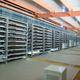Racks of litecoin mining machines in a warehouse building in Ordos.